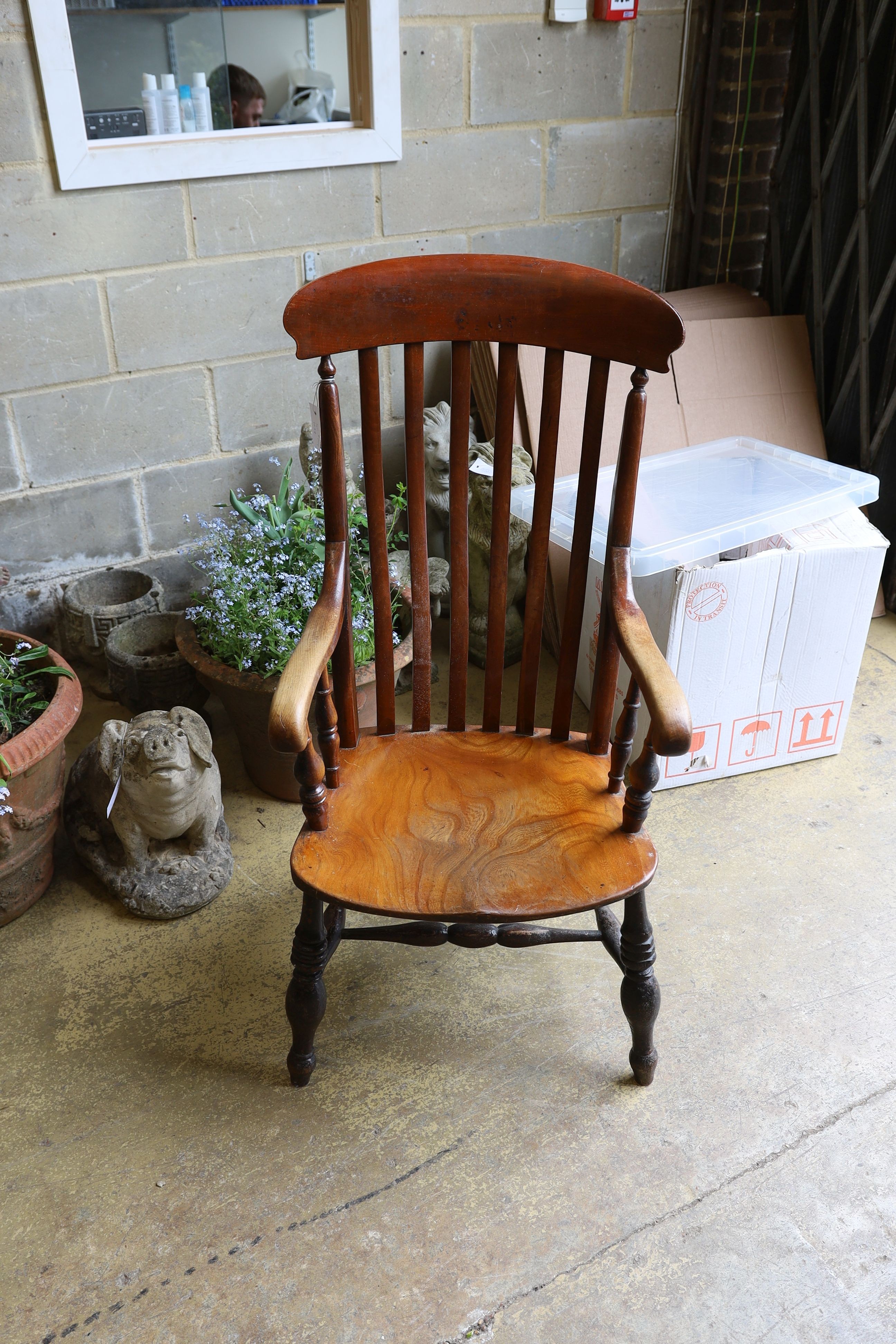 A Victorian elm and beech Windsor lathe back armchair.